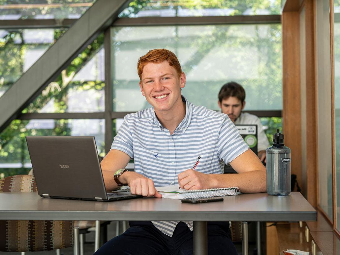 Male business student posing indoors.