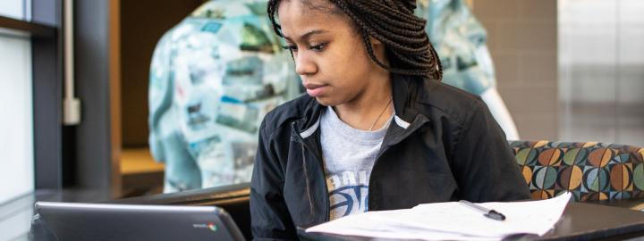 Student studying her class notes.