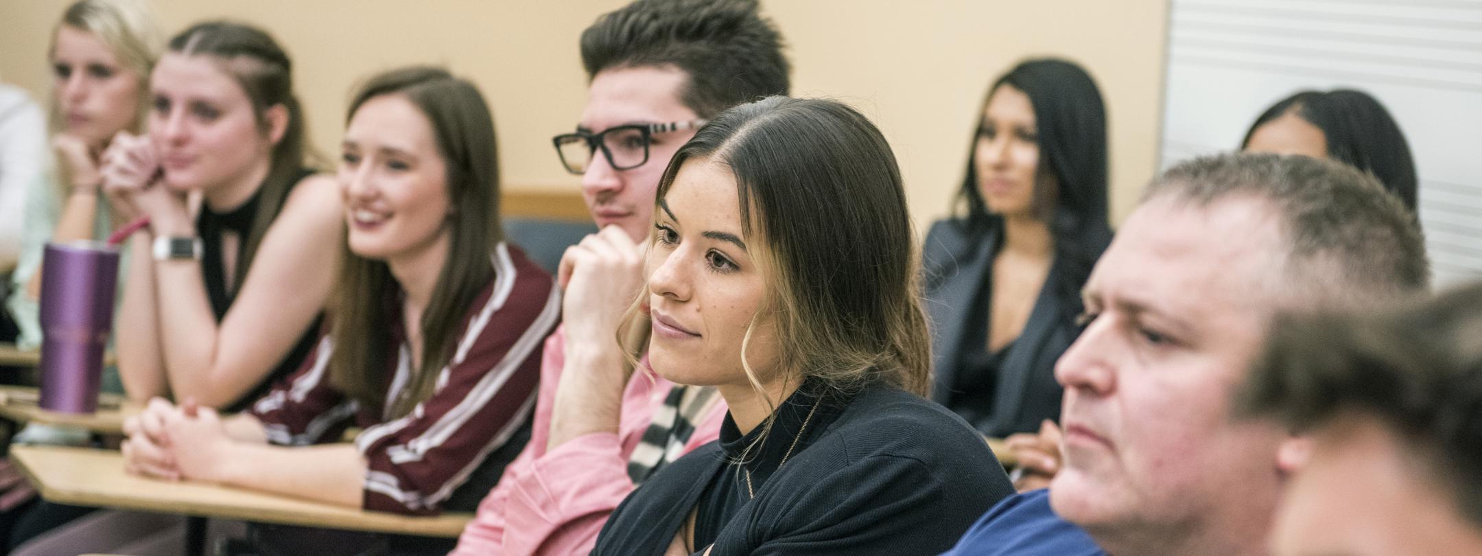 An MBA class listens to a a guest speaker